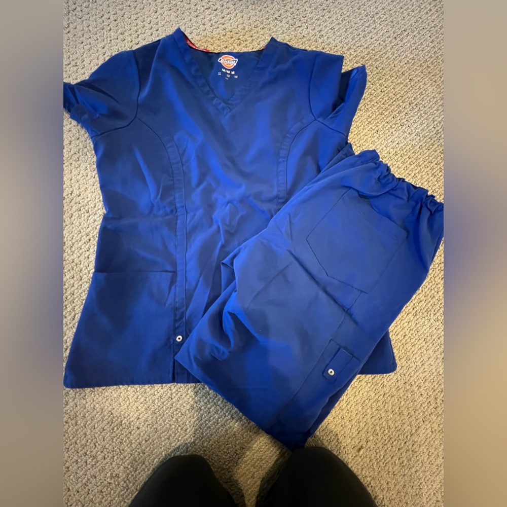 Darker blue scrubs. Flowy, stretchy, soft.